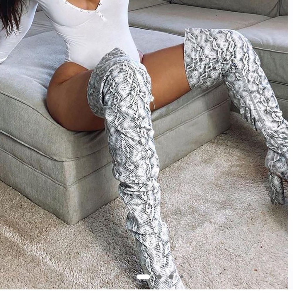 Heeled boots, thigh high, black and white.